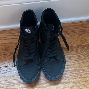 All black high top Vans